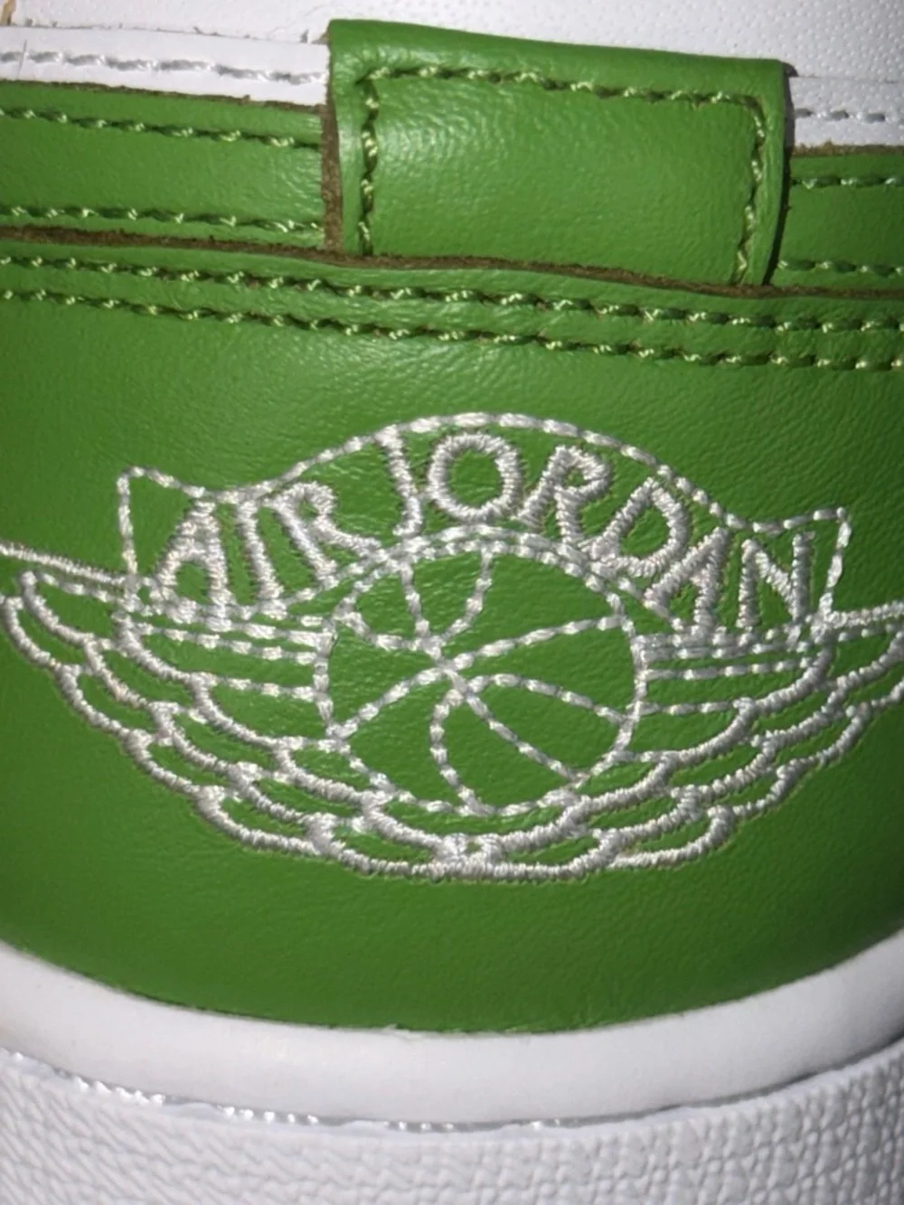 Nike Jordan 1  SE White and Green Low-Top Sneakers with Yellow Logo